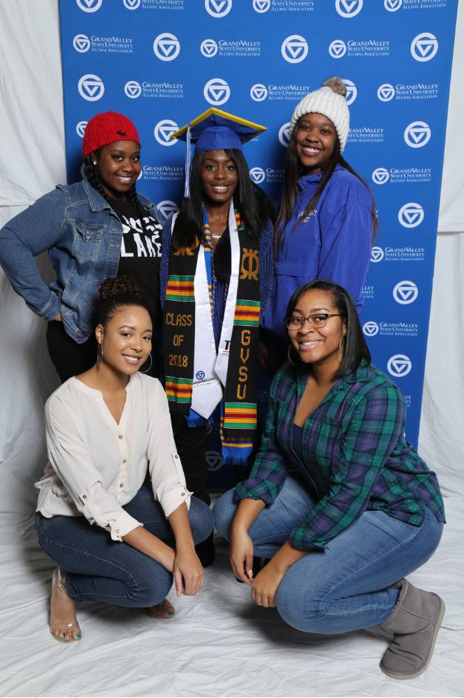 Group photo of graduate and friends at Gradfest